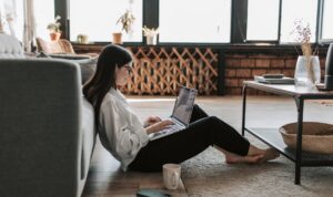 woman working at home with her laptop